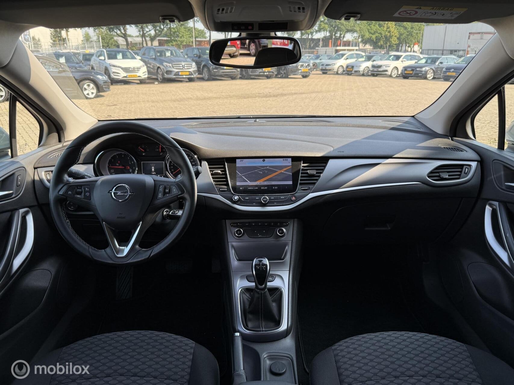 Opel Astra 1.0 Innovation AUTOMAAT | NAVI | PDC | TREKHAAK, Gebruikt, 610 kg, 23 km/l, Bedrijf