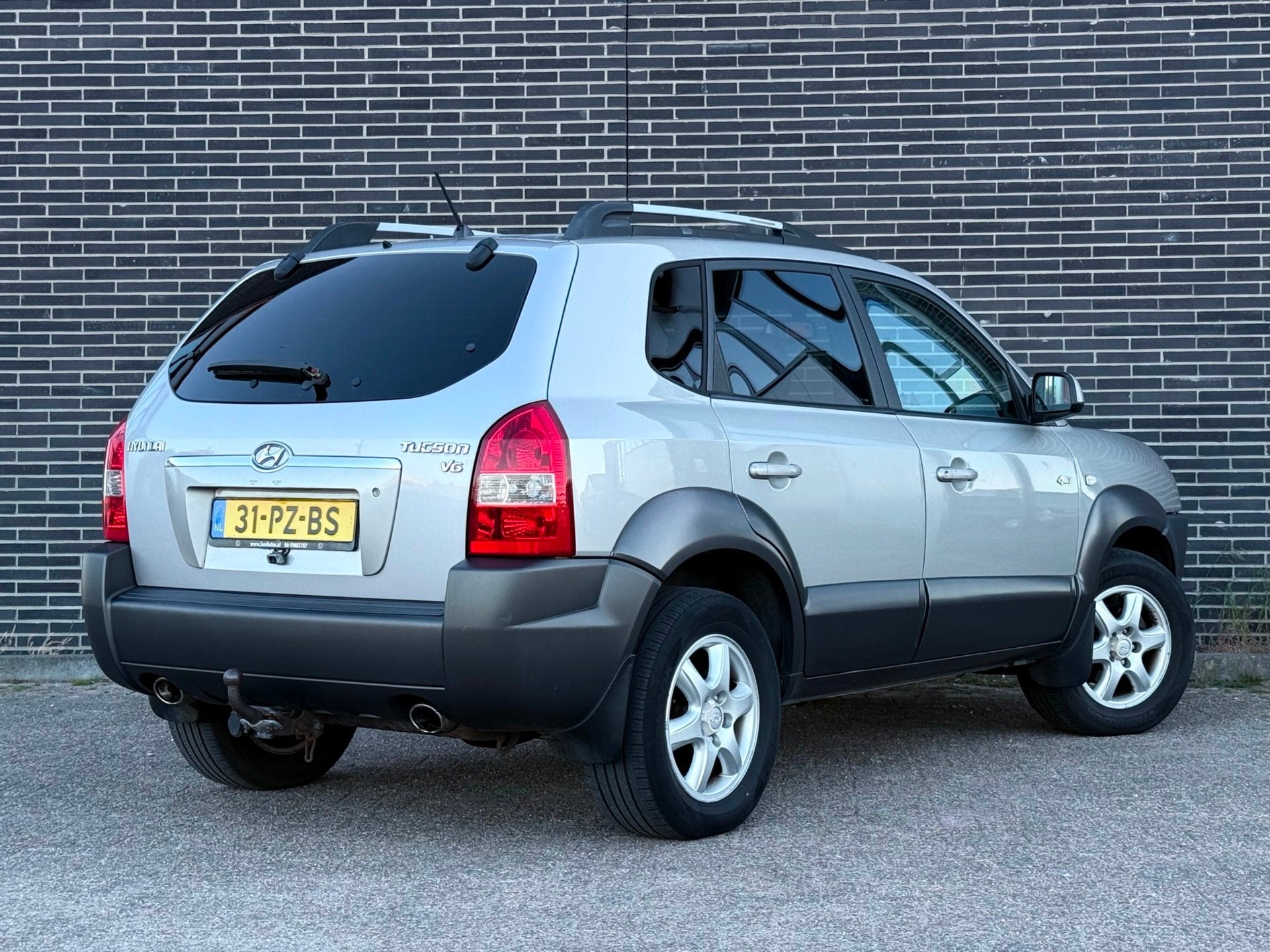 Hyundai Tucson 2.7i V6 4WD Style Automaat, Clima, Cruise!, Auto's, Automaat, Gebruikt, 2656 cc, Bedrijf