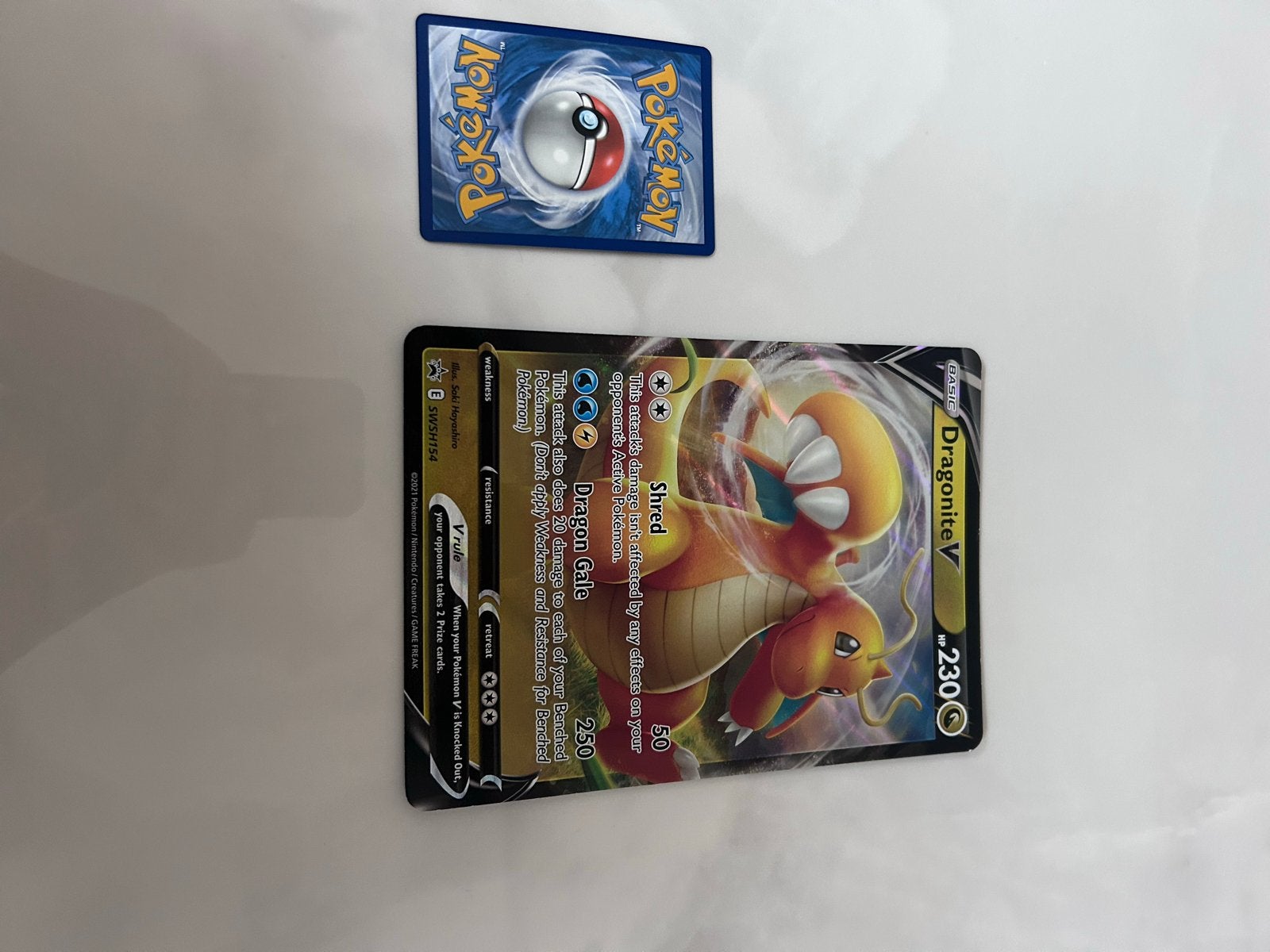 Pokémon Dragonite V SWSH154 kaart, Ophalen, Zo goed als nieuw, Losse kaart