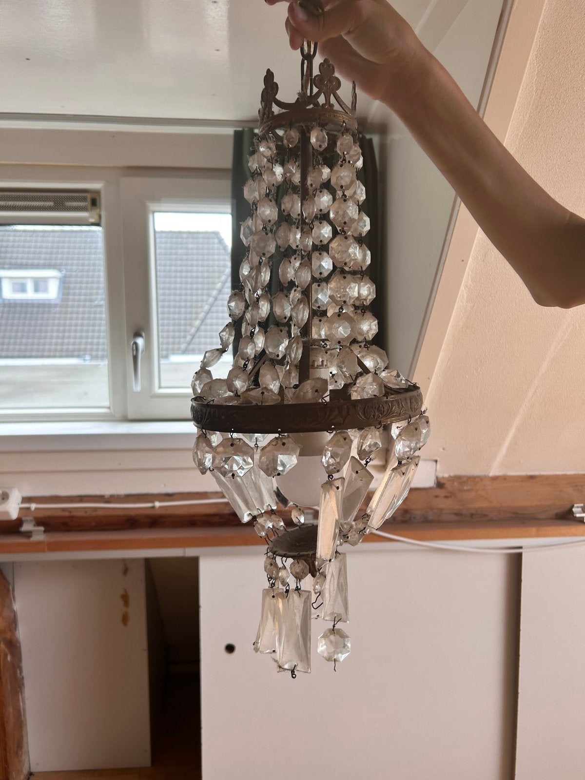 Antieke kristallen kroonluchter, Ophalen