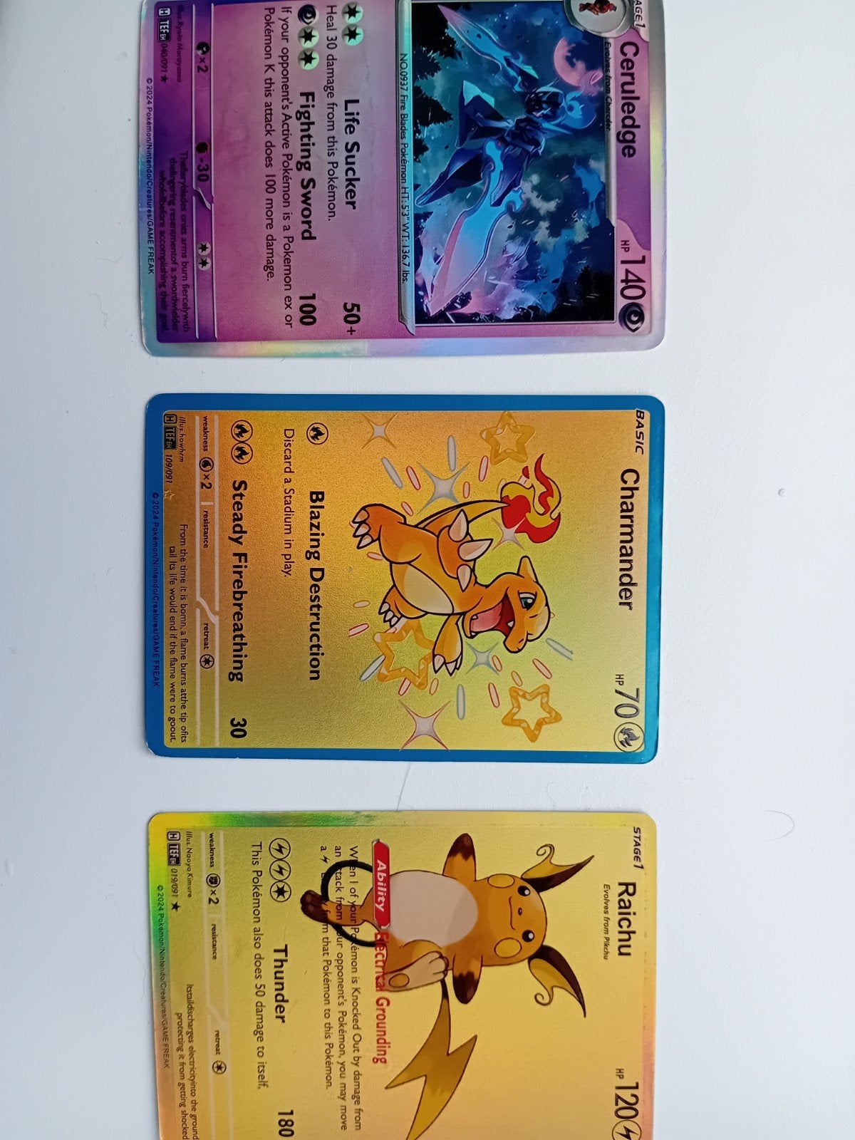 3 Pokemon kaarten: Raichu, Charmander, Ceruledge, Ophalen of Verzenden, Zo goed als nieuw, Meerdere kaarten, Foil