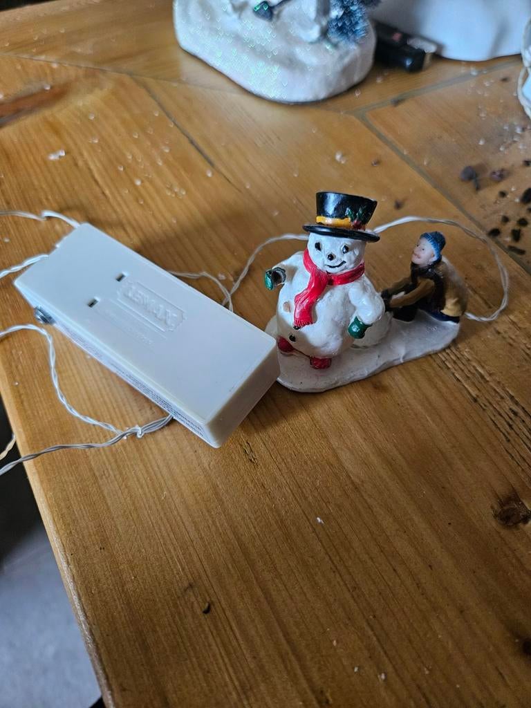 Sneeuwpop verlicht lemax, Ophalen