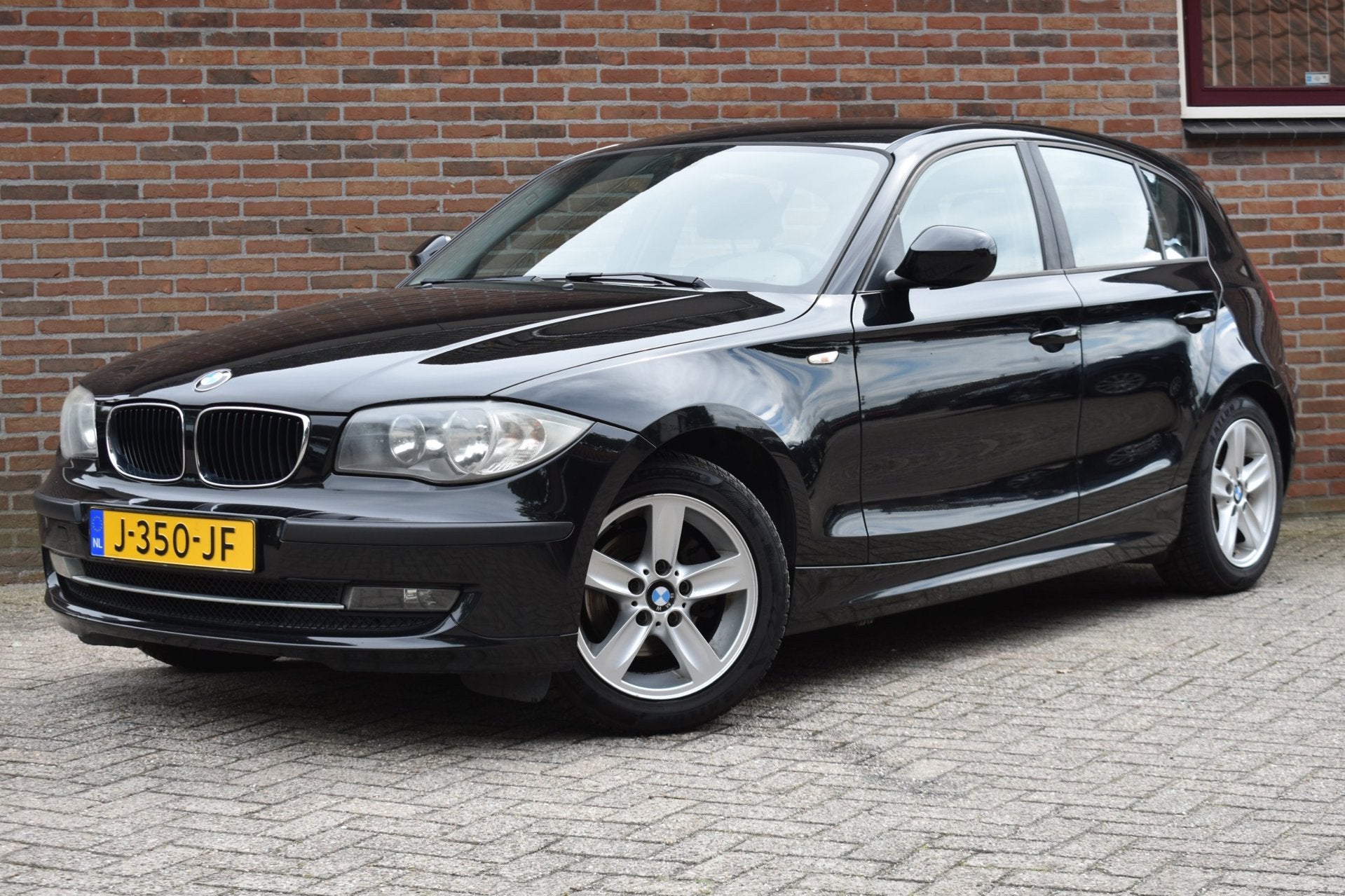 BMW 1-serie 116i '11 Airco Inruil mogelijk, Auto's, BMW, 1-Serie, Euro 5, Achterwielaandrijving, Zwart