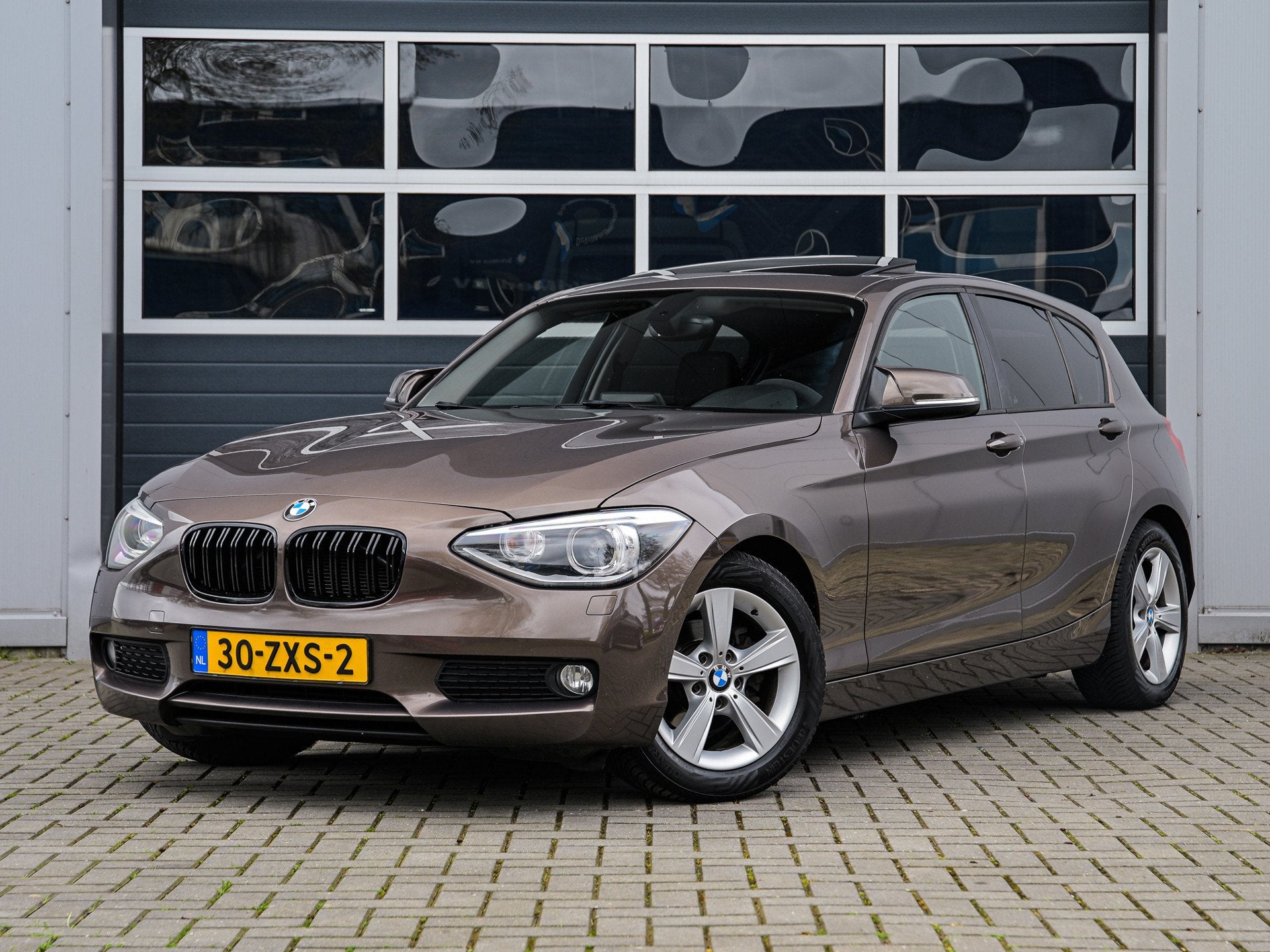 BMW 1-serie 114i Upgrade Edition | Leder | Schuifdak | Xenon, 1-Serie, Euro 5, Achterwielaandrijving, Gebruikt