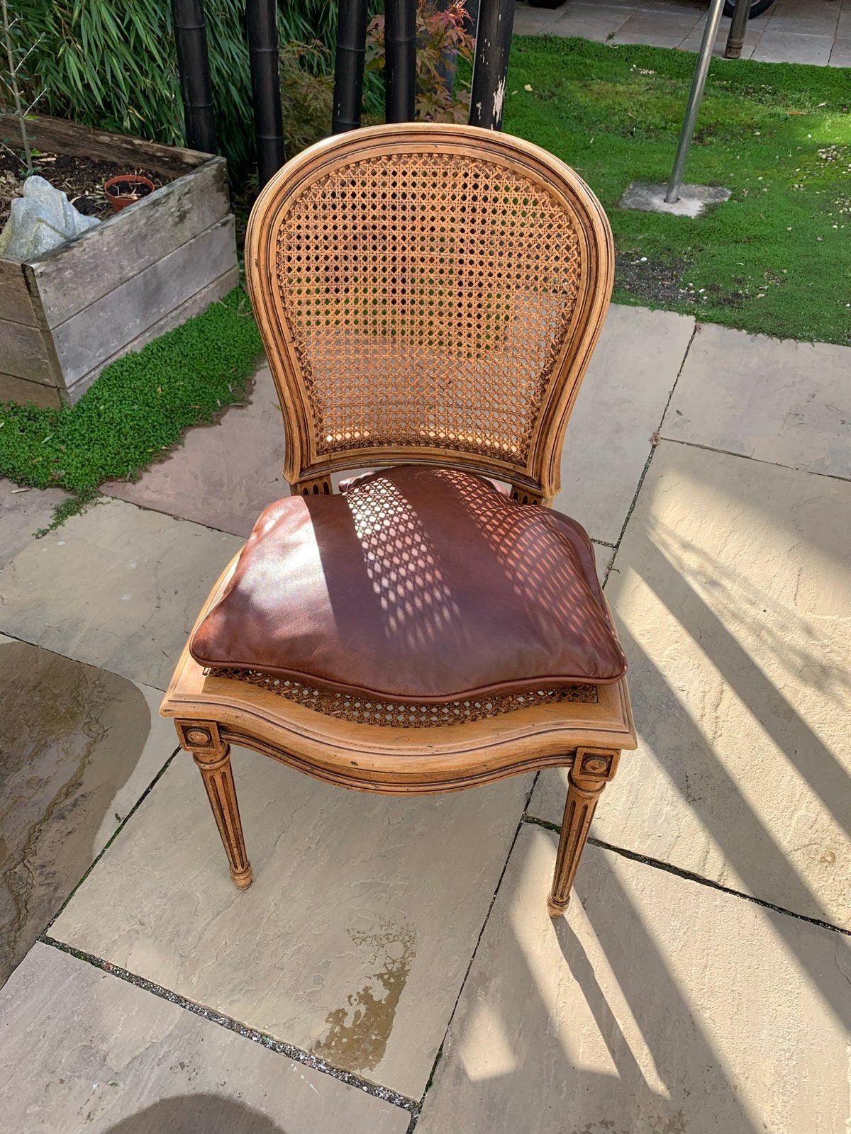 Vintage rotan stoel met lederen kussen, Ophalen