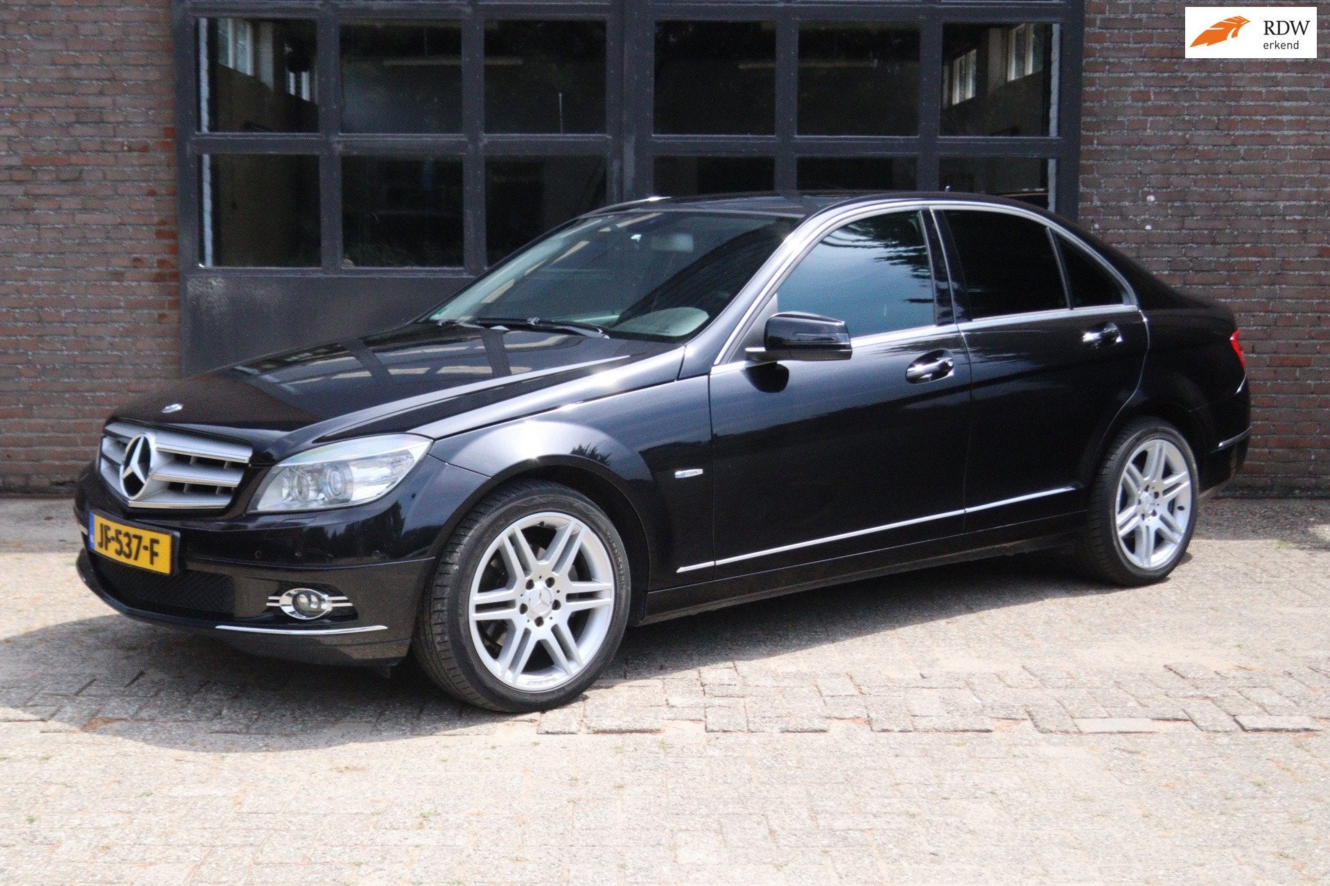 Mercedes-Benz C-klasse 180 K BlueEFFICIENCY / Nieuwe APK, Gebruikt, Zwart, Leder en Stof, Zwart