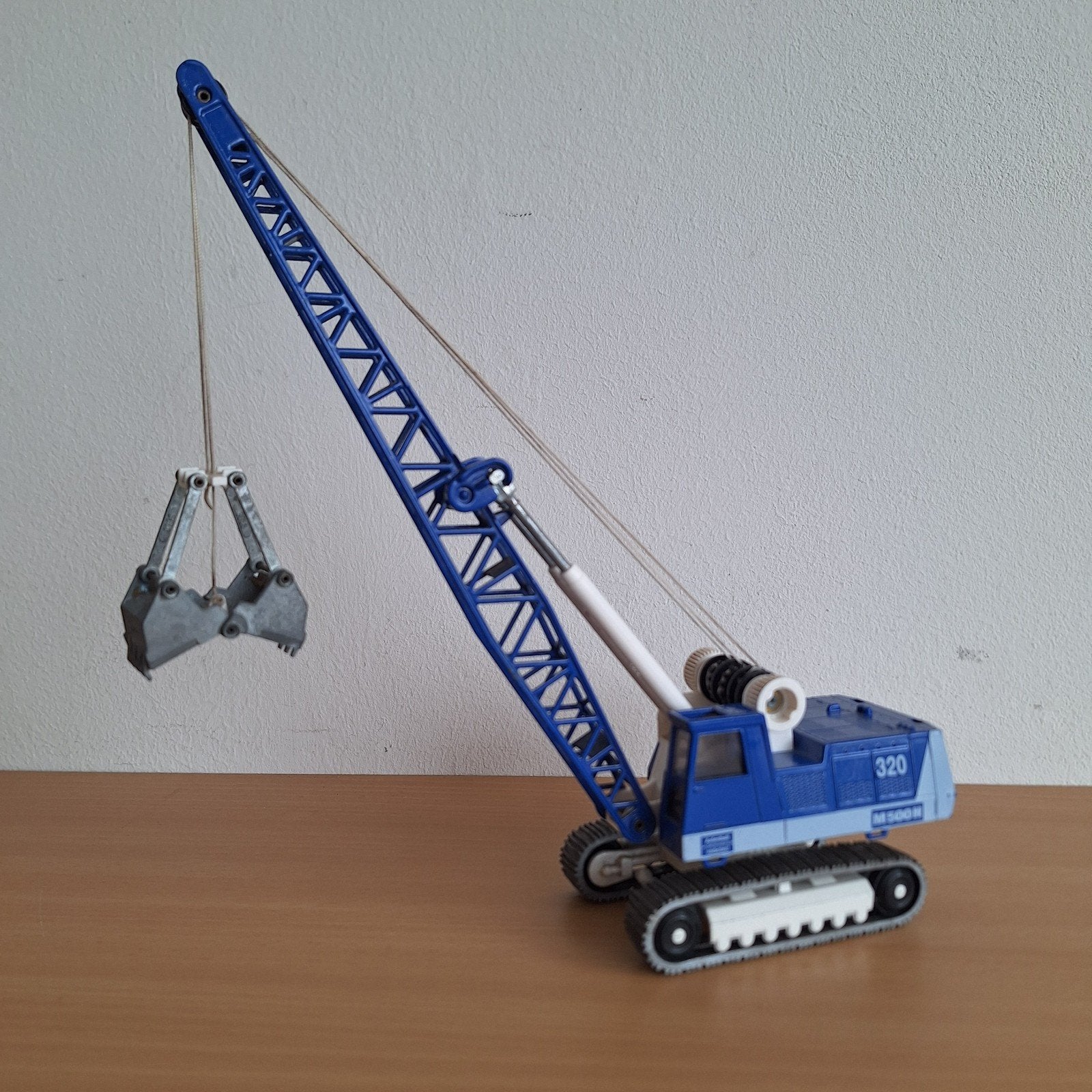 te koop Siku bagger M500H, Hobby en Vrije tijd, Modelauto's | 1:50, Ophalen of Verzenden, Zo goed als nieuw, Bus of Vrachtwagen
