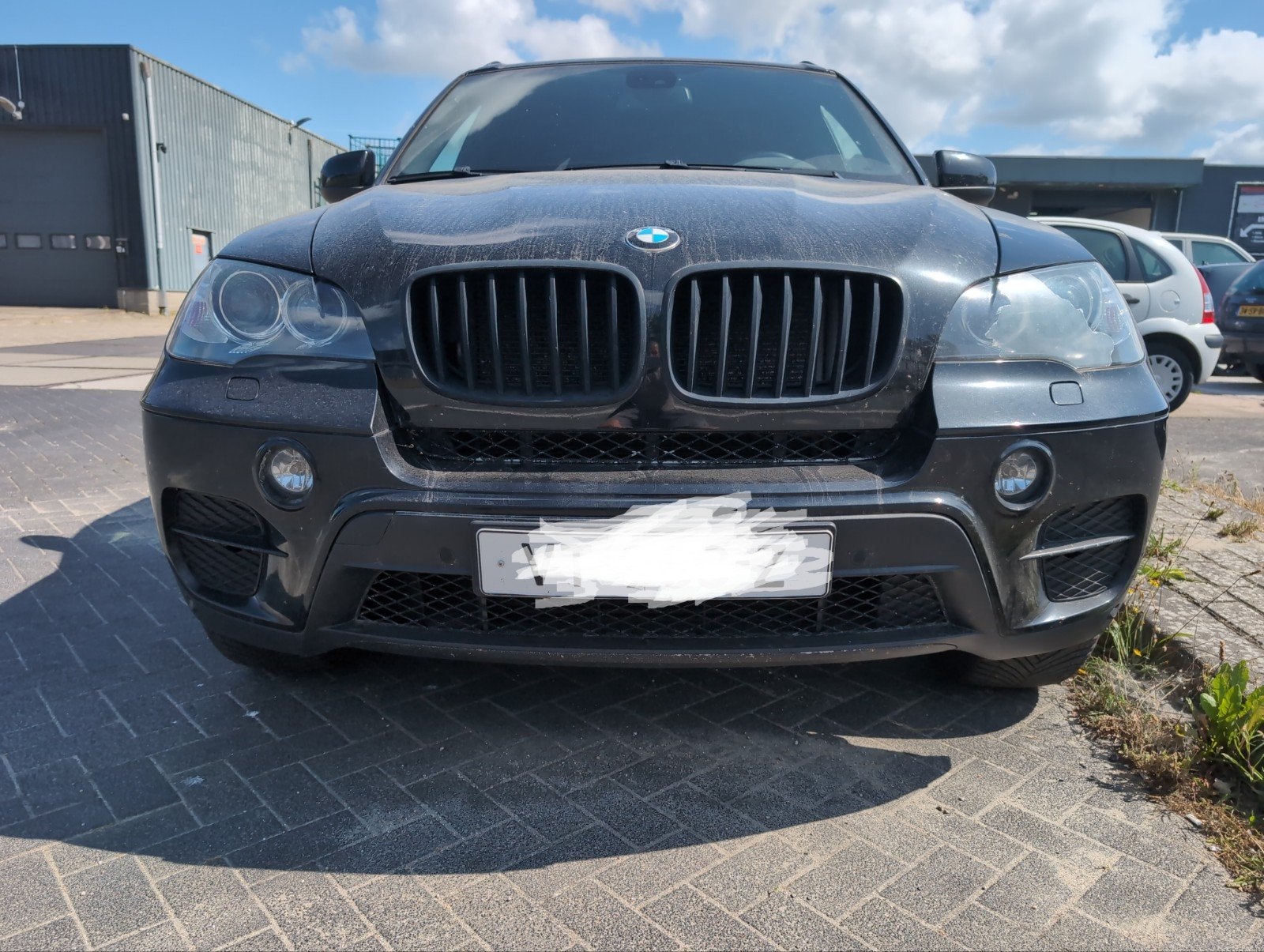 BMW E70 X5 LCI Voorbumper met PDC en mistlampen, Ophalen, Gebruikt, Voor, Bumper