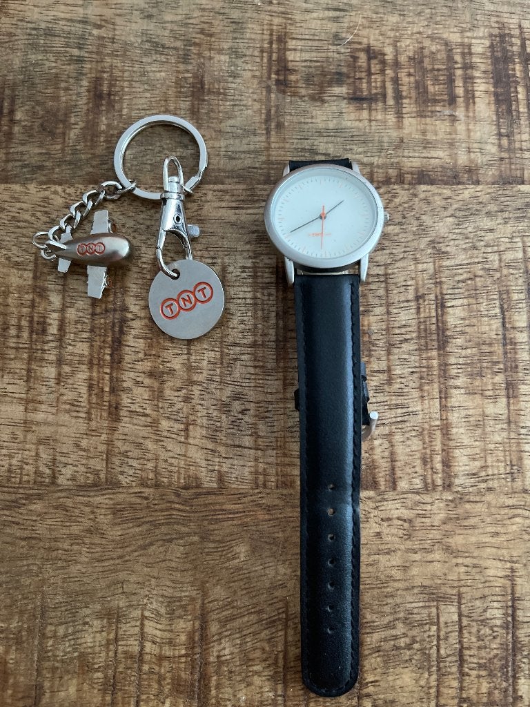 TNT horloge en winkelwagen munt, Overige merken, Nieuw, Ophalen of Verzenden, Groter dan 1:32
