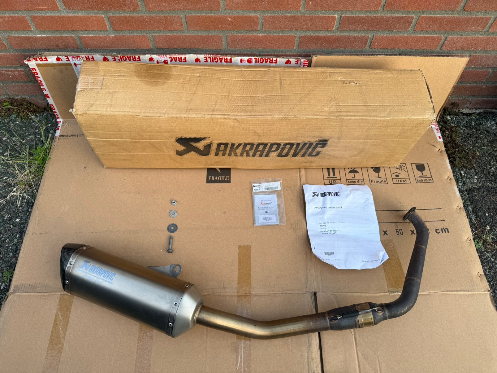 Akrapovic Volledig Uitlaatsysteem Yamaha YZF R125 Carbon, Ophalen of Verzenden, Gebruikt