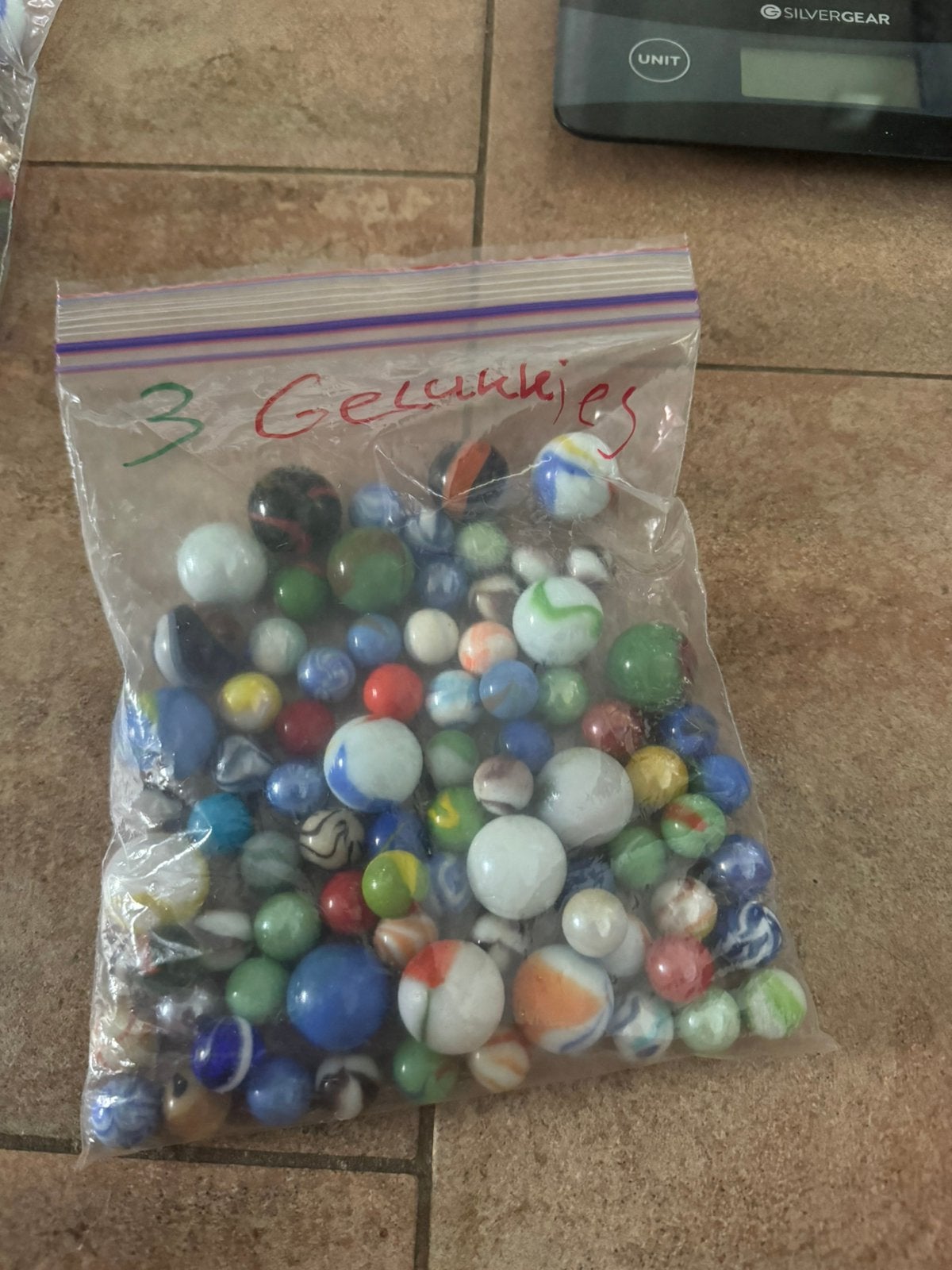zakje van 650g gelukkies knikkers, Ophalen of Verzenden, Zo goed als nieuw