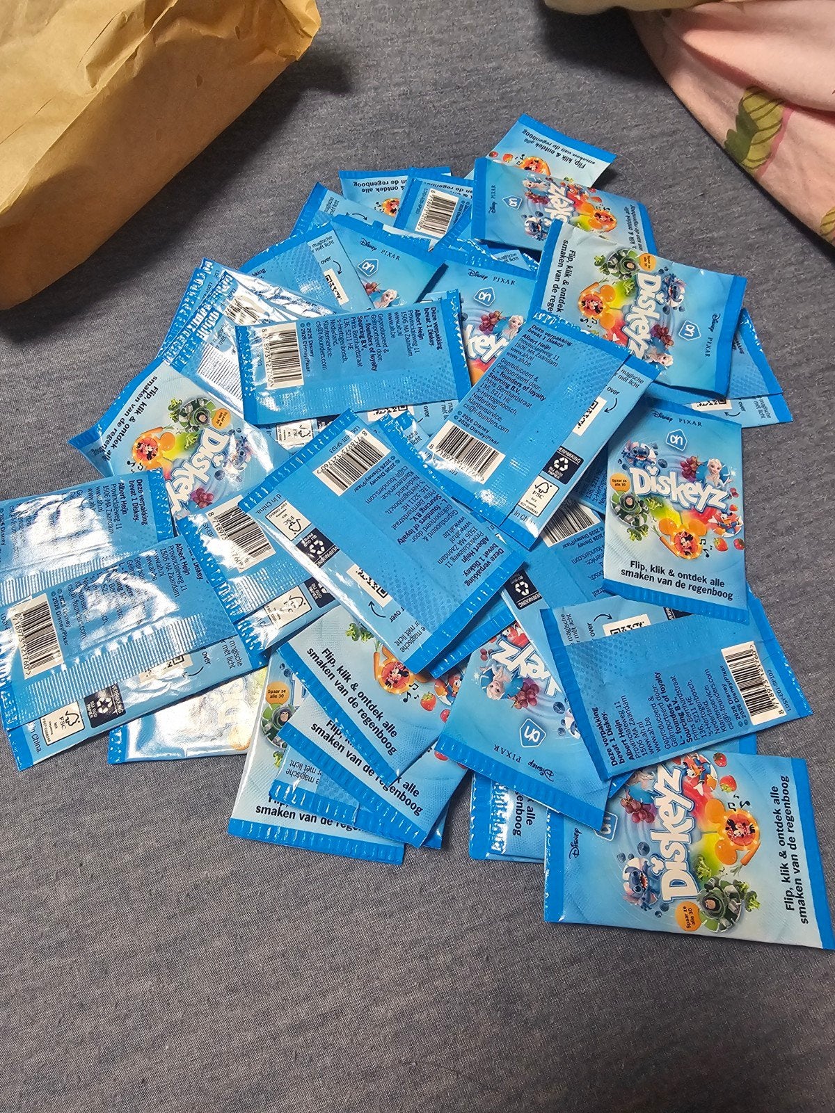 65 ongeopende AH Diskeyz - Disney Pixar spaaractie, Ophalen of Verzenden, Nieuw