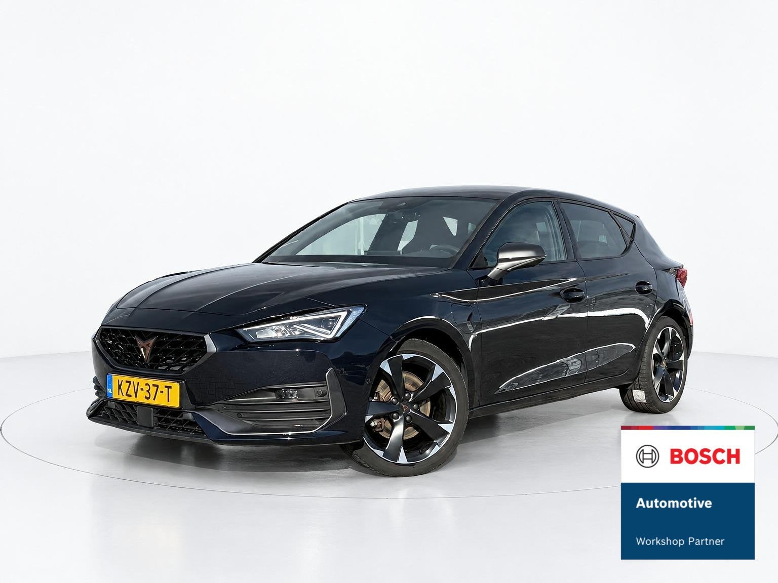 CUPRA Leon 1.4 e-Hybrid Business MEMORY - CAMERA - CRUISE, Auto's, Stof, Gebruikt, 4 cilinders, Verwarmde buitenspiegels