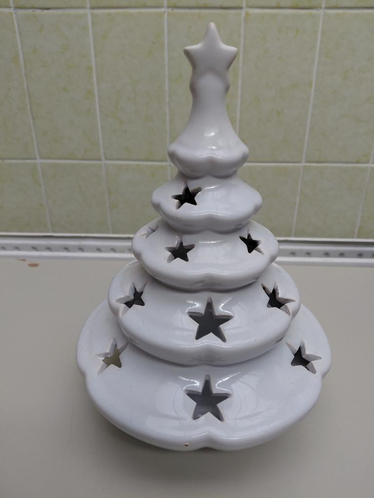 Kerstboomkaarsenhouder, Ophalen
