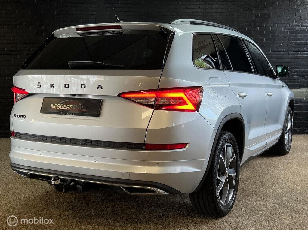 Skoda Kodiaq 1.5 TSI Sportline Business 1e EIG LED ADAP DSG, Auto's, Skoda, Zwart, 4 cilinders, 150 pk, Automatische klimaatregeling