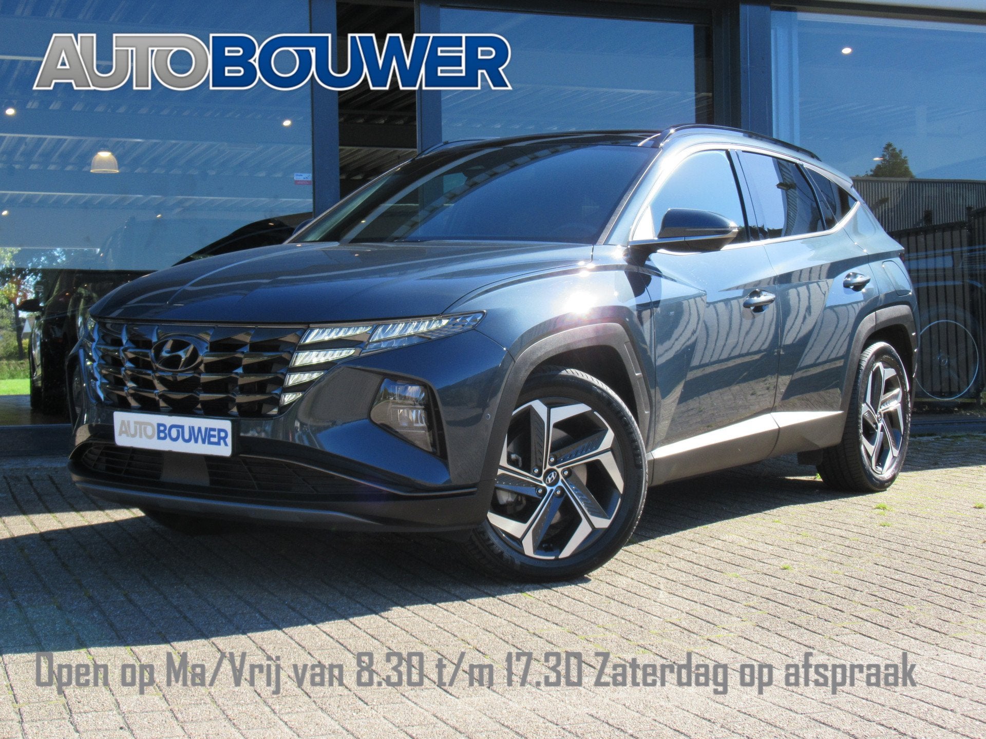 Hyundai Tucson 1.6 T-GDI PHEV 265 PK Premium Sky 4WD 1e eige, Auto's, Automaat, Gebruikt, Zwart, 4 cilinders
