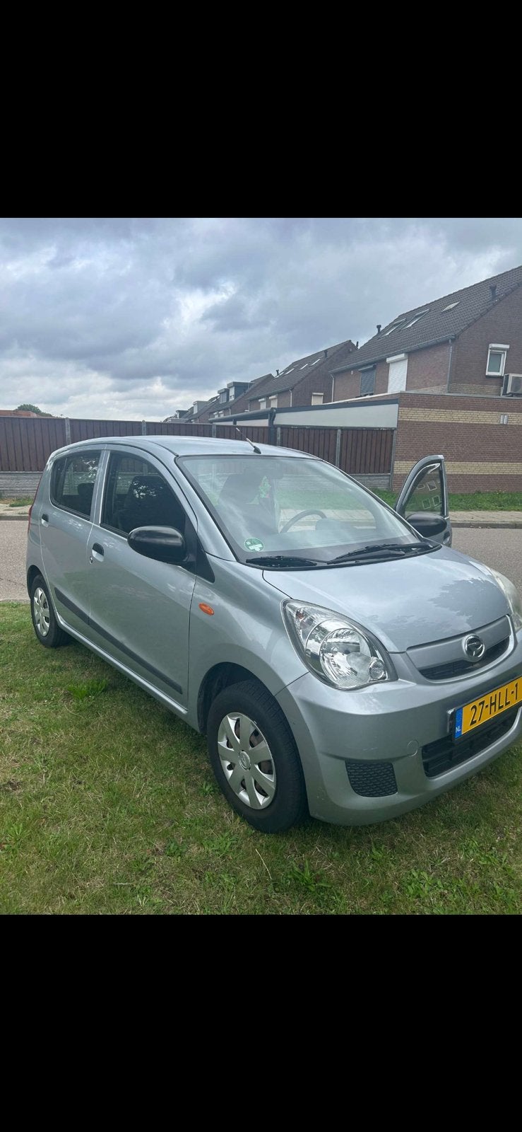 Daihatsu Cuore 1.0 5D 2009 Grijs, Voorwielaandrijving, Stof, 600 kg, Zwart