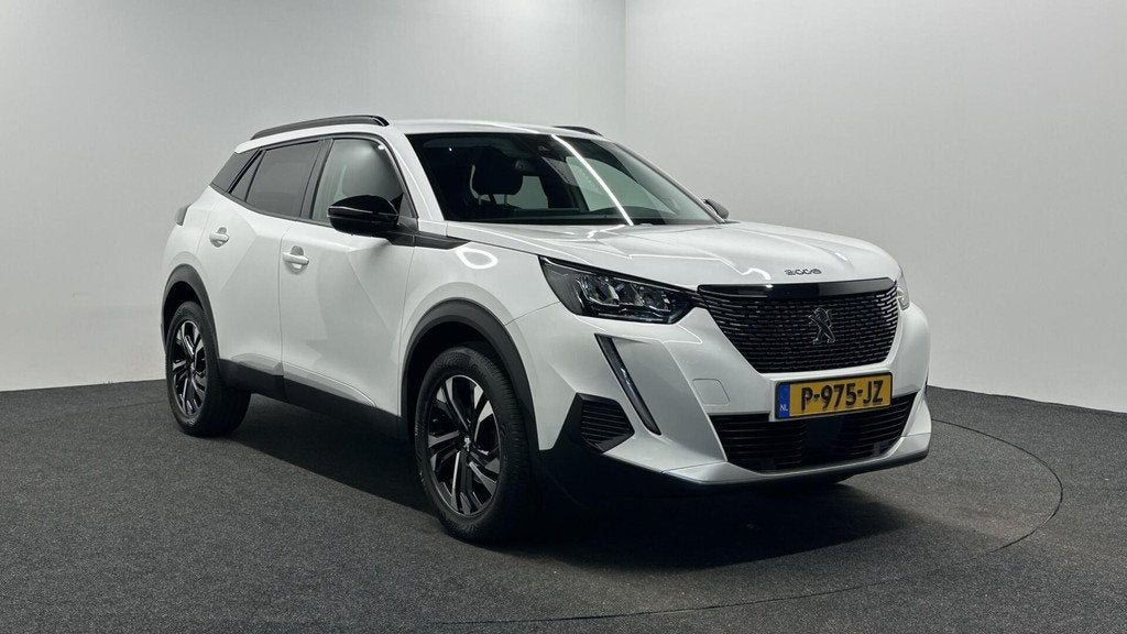 Peugeot 2008 1.2 PureTech Allure Pack CAMERA ECC CRUISE LM N, Auto's, Peugeot, Gebruikt, 1199 cc, Met garantie (alle), Leder en Stof
