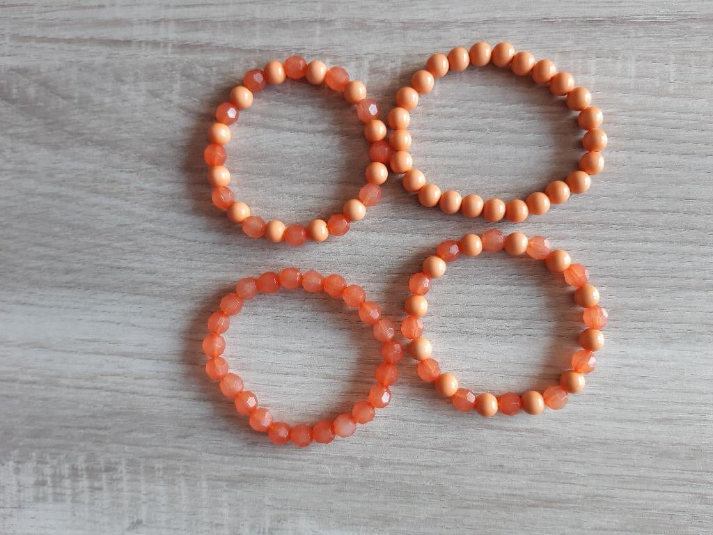 Oranje kralen armbanden., Overige materialen, Nieuw, Oranje, Ophalen of Verzenden