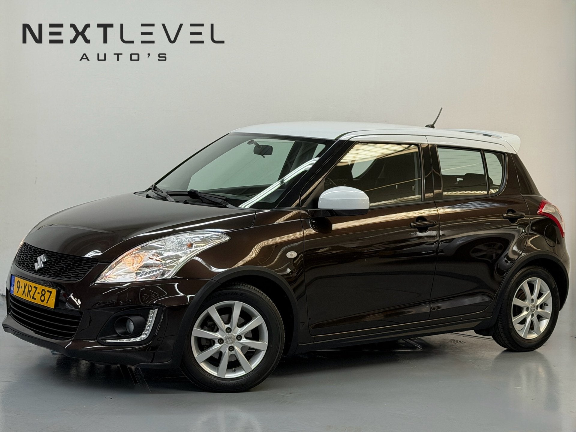 Suzuki Swift 1.2 Dynamic EASSS Led Airco Cruise Stoelverwarm, Auto's, Stof, Gebruikt, 4 cilinders, Bruin