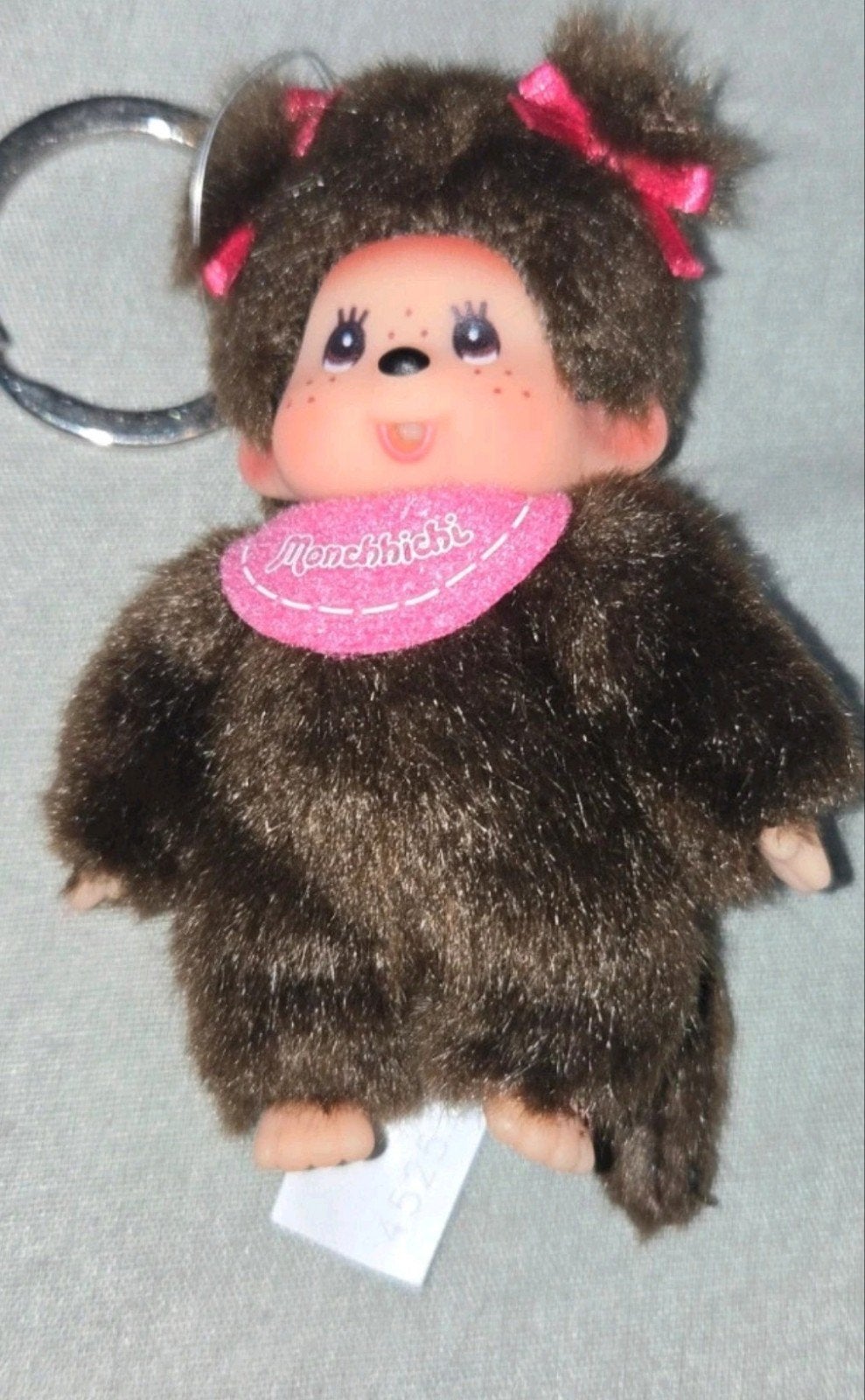 Monchhichi sleutelhanger aapje bruin roze slabbetje, Gebruikt, Overige merken, Overige karakters, Ophalen of Verzenden