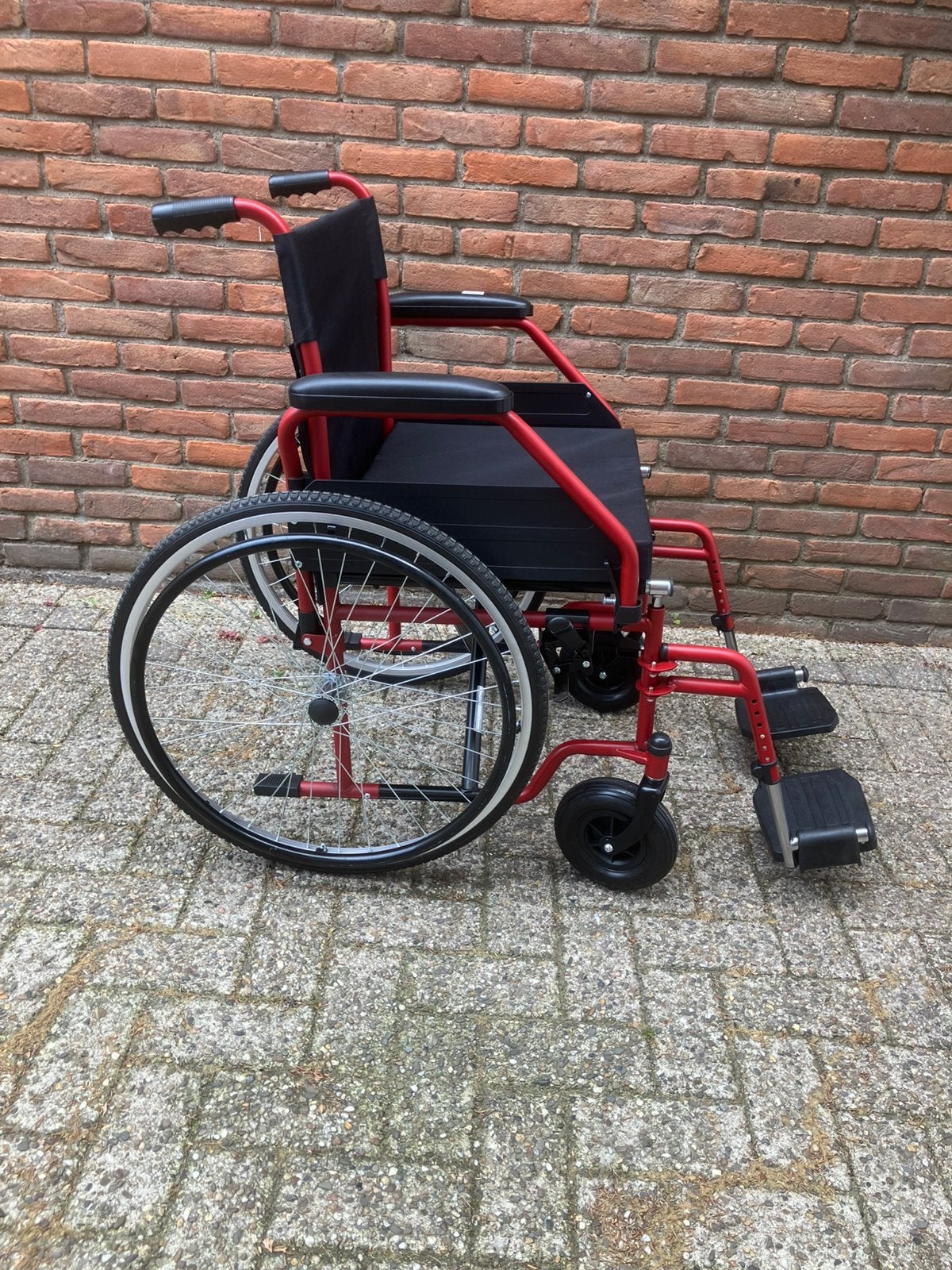 Brede inklapbare rolstoel 52 cm Nieuwstraat, Ophalen, Inklapbaar, Zo goed als nieuw, Duwrolstoel