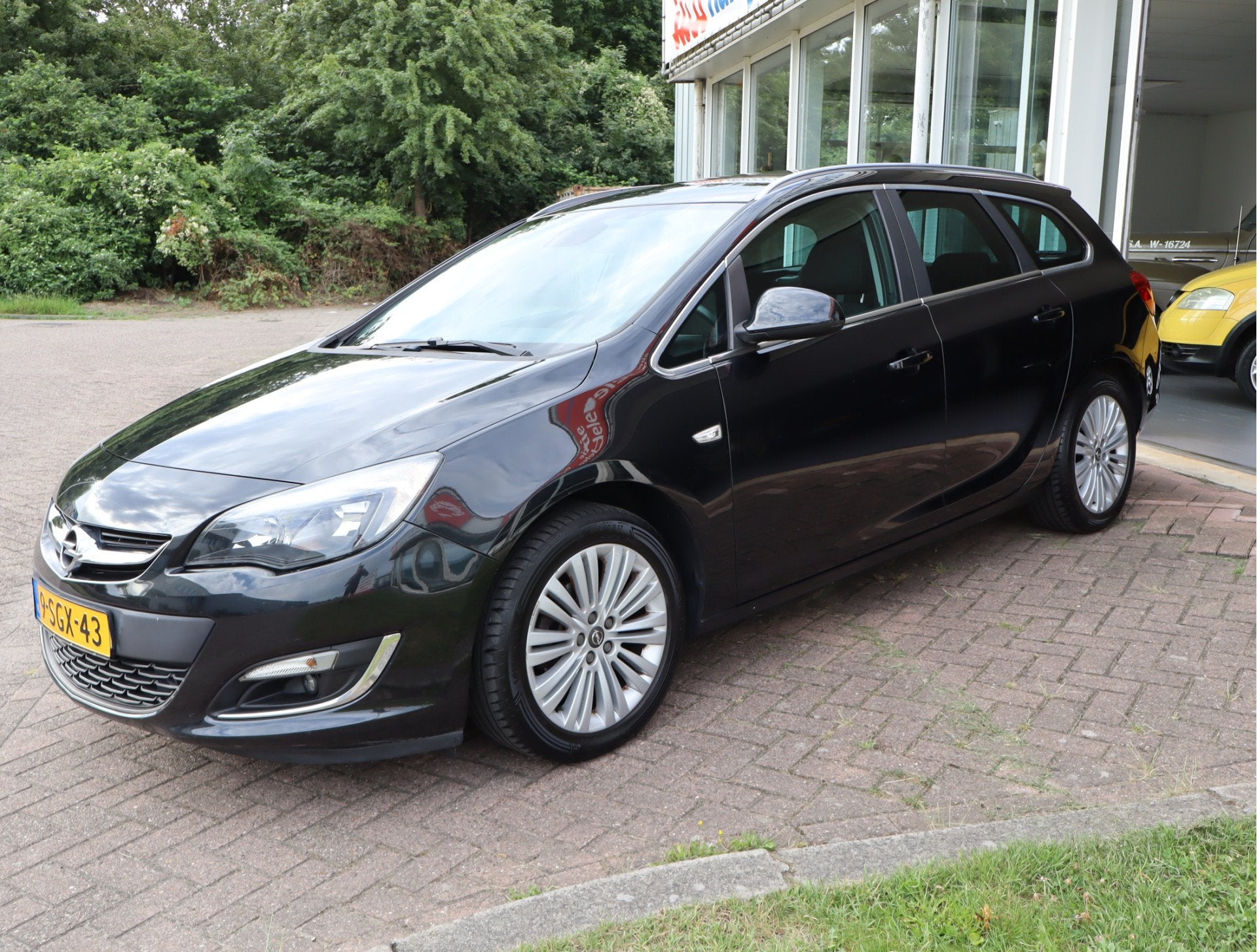 Opel Astra Sports Tourer 1.4 Turbo Design Edition Keurige Au, Auto's, Voorwielaandrijving, Euro 5, Stof, Zwart