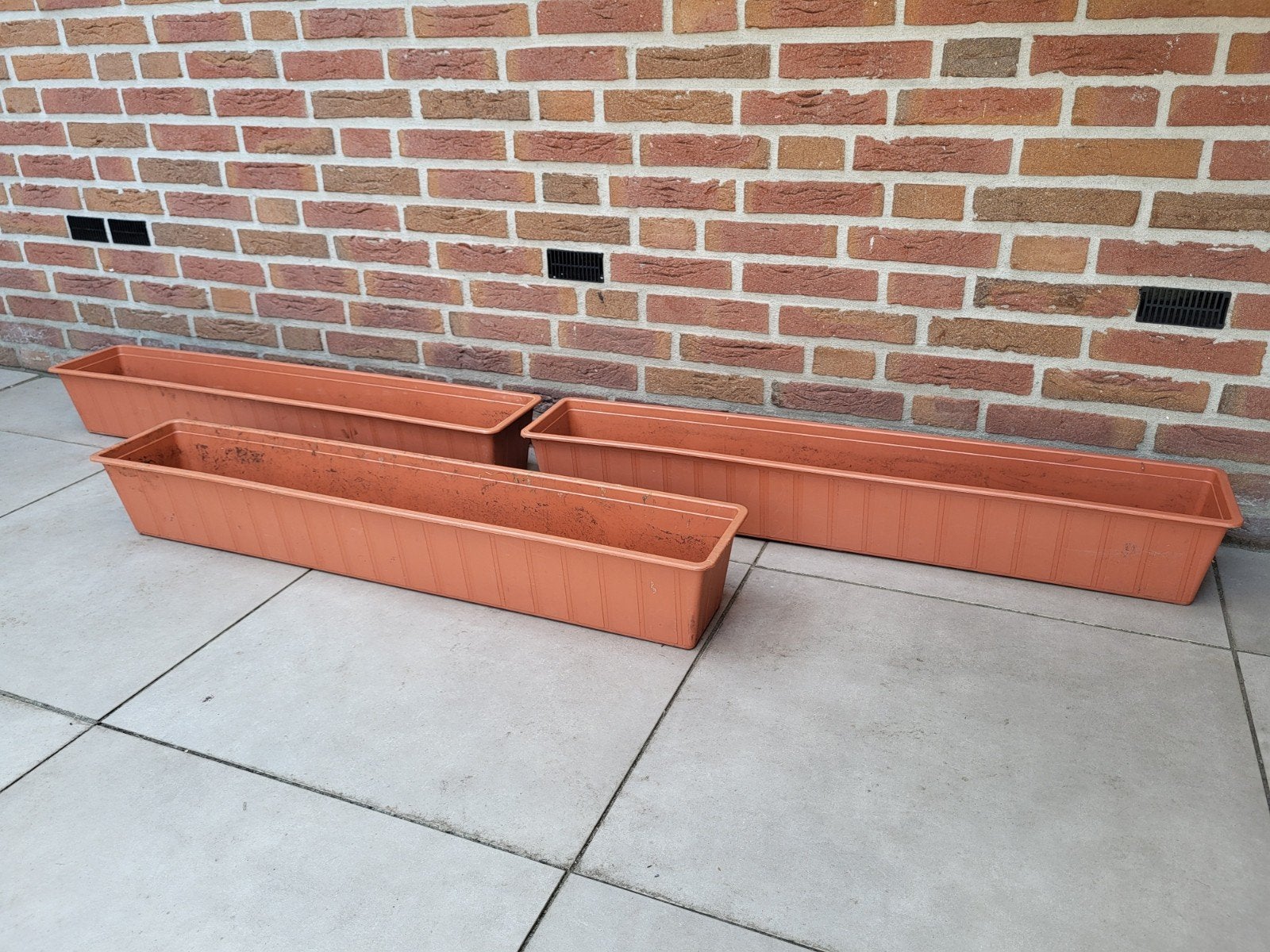 3 terracotta kleur kunstof bloembakken van 1m, Ophalen, Rond, Kunststof, Minder dan 30 cm