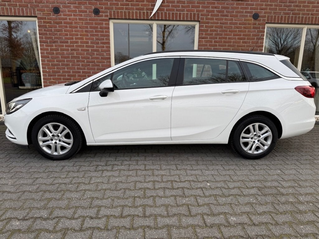 Opel Astra Sports Tourer 1.0 T. Business 105PK NAVI / AIRCO, Auto's, 21 km/l, Stof, Gebruikt, 1178 kg