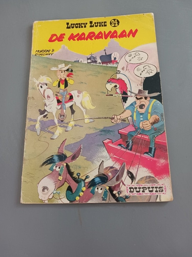 Lucky Luke, de Karavaan 1ste druk, goede staat, Eén stripboek, Ophalen of Verzenden, Gelezen