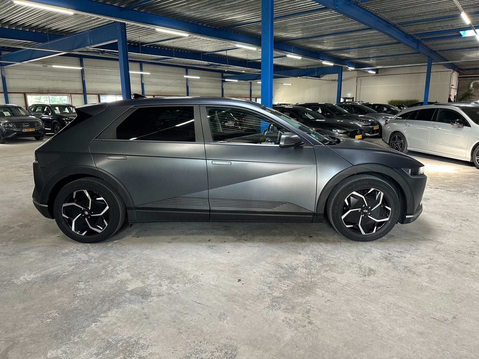Hyundai IONIQ 5 Style 77.4 kWh | Warmtepomp | MHC budget Car, Auto's, 228 pk, Stof, Gebruikt, Zwart