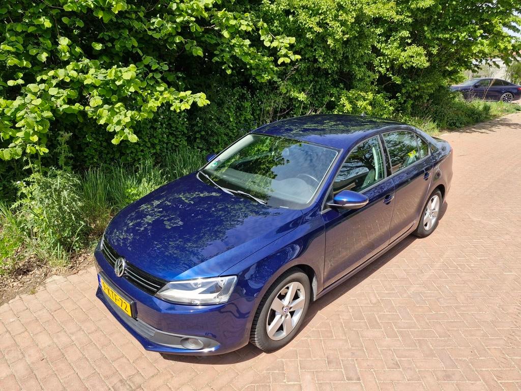 Volkswagen Jetta 1.2TSI 77KW H6 2012 Blauw, Auto's, Volkswagen, Voorwielaandrijving, Zwart, 4 cilinders, Blauw