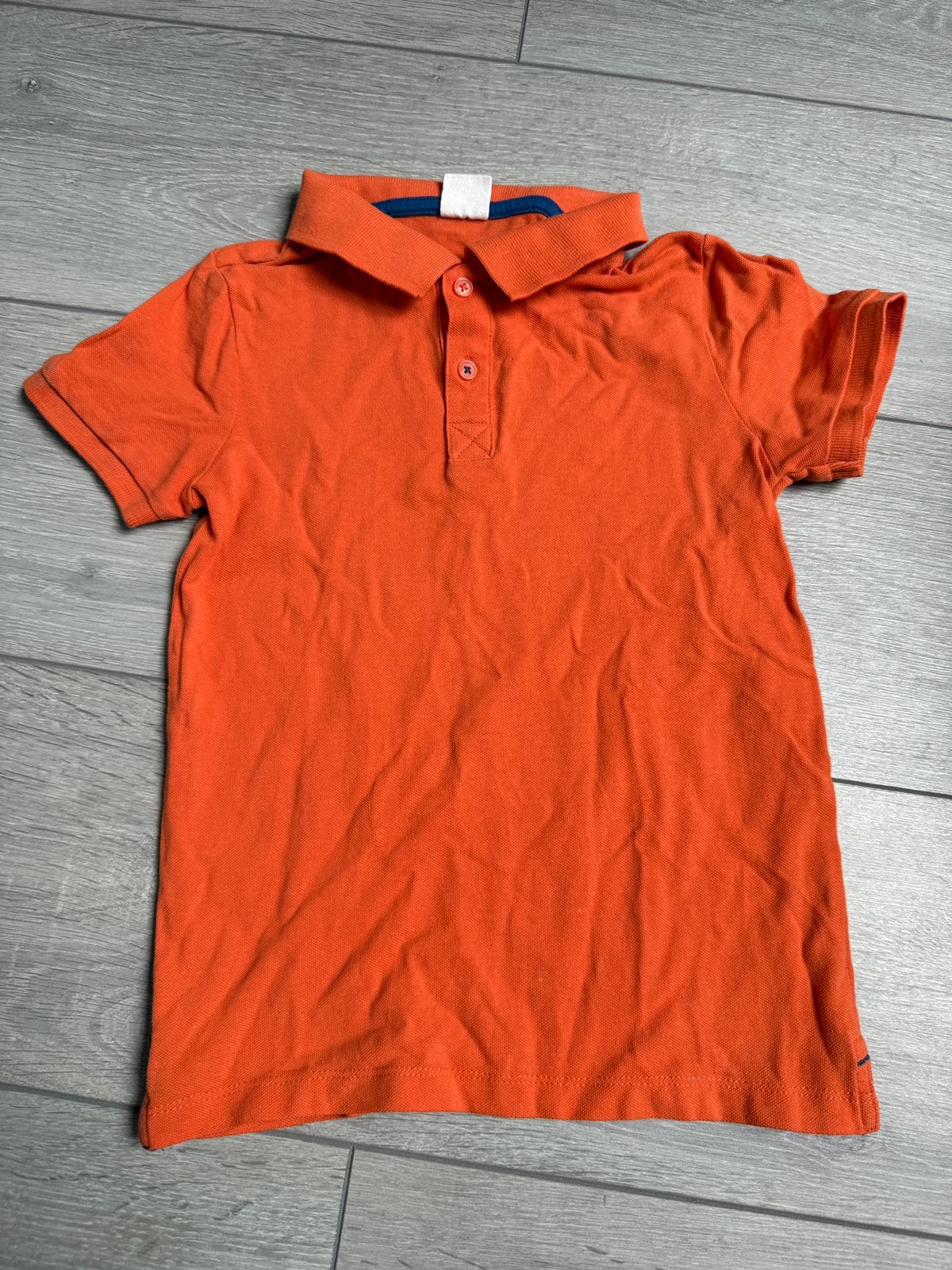 Oranje polo maat 122 / 128, Ophalen of Verzenden, Zo goed als nieuw, Jongen, Shirt of Longsleeve