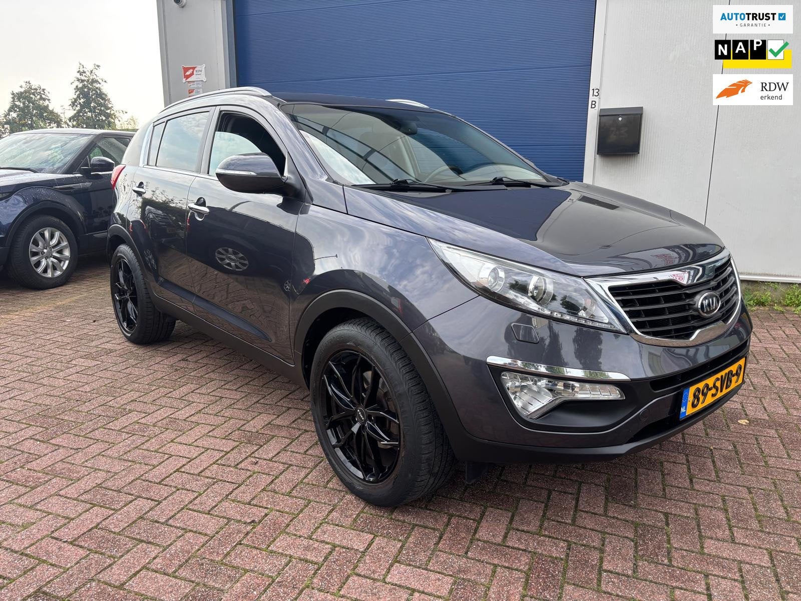 Kia Sportage 2.0 X-clusive INCL NWE APK!, Auto's, Gebruikt, Zwart, 4 cilinders, 163 pk