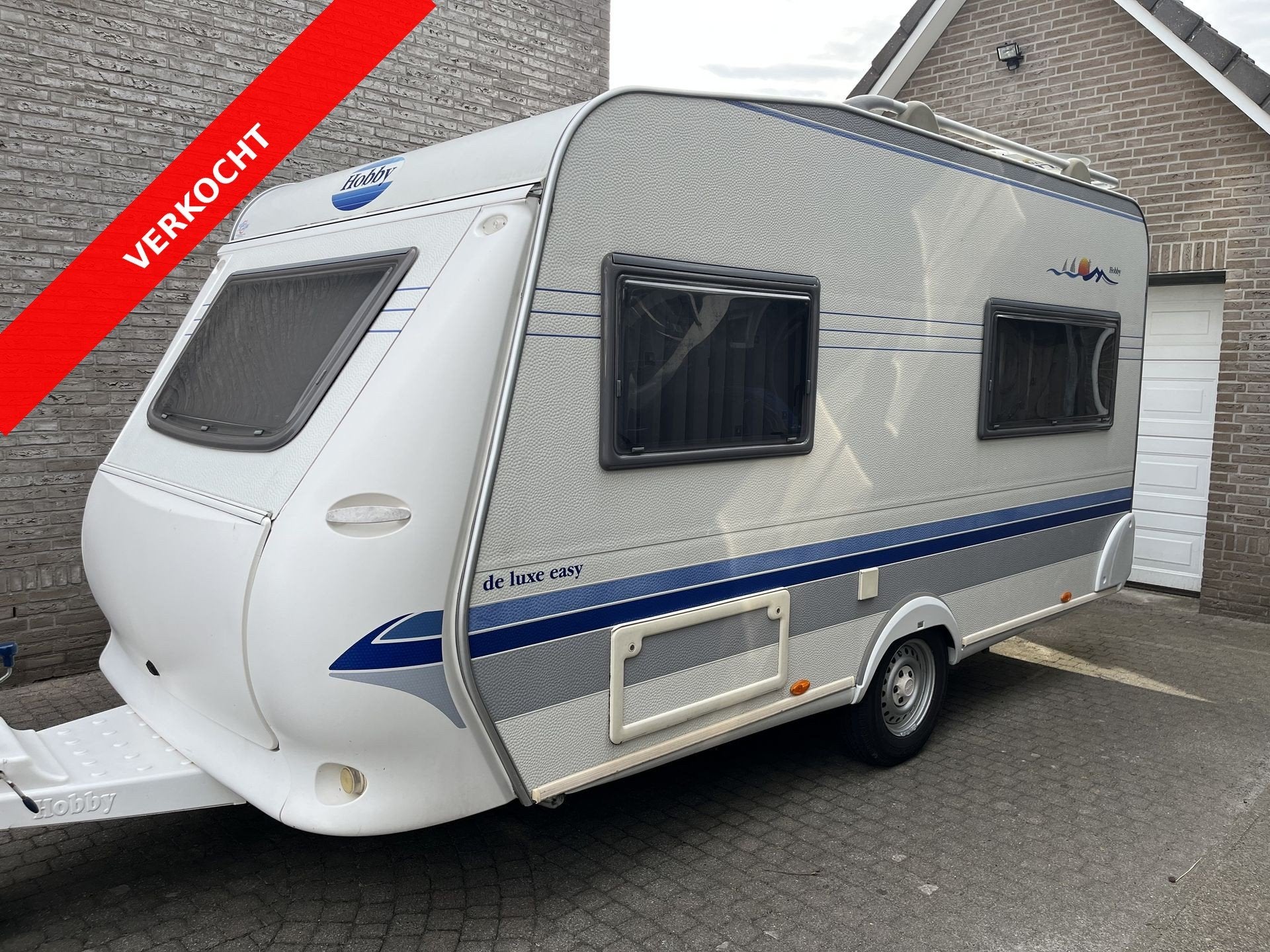 Hobby 400 SF de luxe VERKOCHT (bj 2003), Caravans en Kamperen, Caravans, Hobby, Bedrijf, 750 - 1000 kg, 4 tot 5 meter