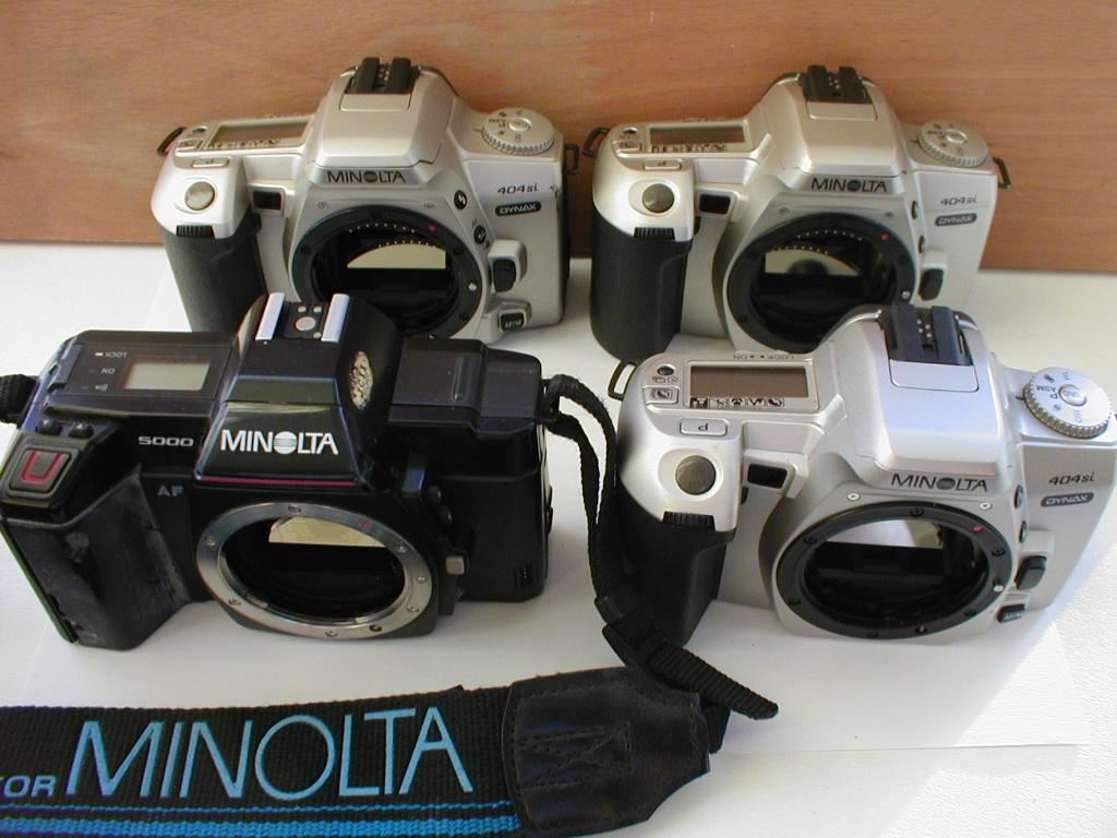 Minolta Dynax 404si ( 3x ) en AF 5000 reflexcamera's, Audio, Tv en Foto, Fotocamera's Analoog, Ophalen of Verzenden, Niet werkend
