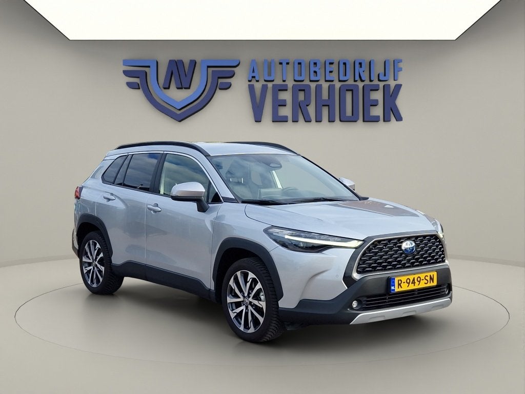 Toyota Corolla Cross 2.0 High Power Hybrid First Edition NL, Auto's, 12 maanden, Gebruikt, 4 cilinders, Leder en Stof