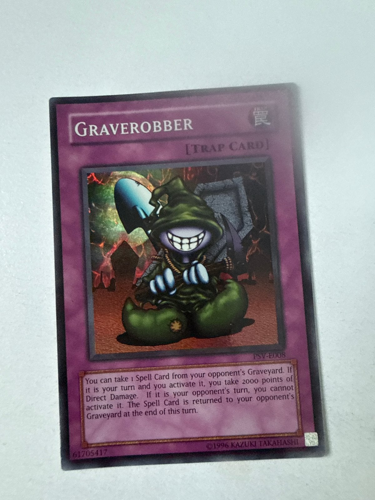 Yu-Gi-Oh! Graverobber Valued Trap Card PSV-E008, Ophalen of Verzenden, Gebruikt, Losse kaart
