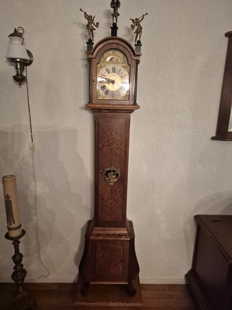 Warmink staande klok met maanstand en bronzen beelden, Ophalen