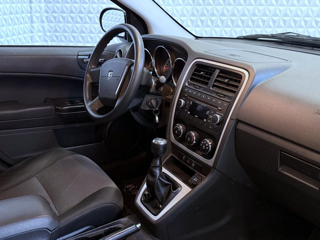Dodge Caliber 2.0 Raw 165.000km / EXPORT - HANDEL! (2011), Auto's, Dodge, 450 kg, Gebruikt, Zwart, Origineel Nederlands
