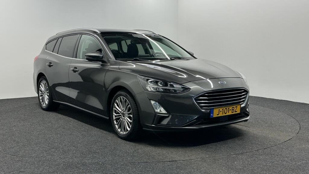 Ford Focus Wagon 1.0 EcoBoost Titanium Business PANO TREKHAA, Auto's, Gebruikt, Automatische klimaatregeling, 1283 kg, Origineel Nederlands