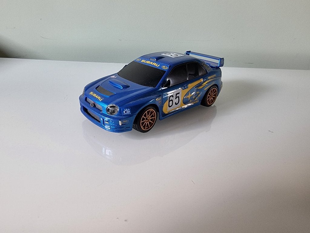 Subaru  Rallye auto 1:24, Ophalen of Verzenden, Gebruikt, Auto, Overige merken