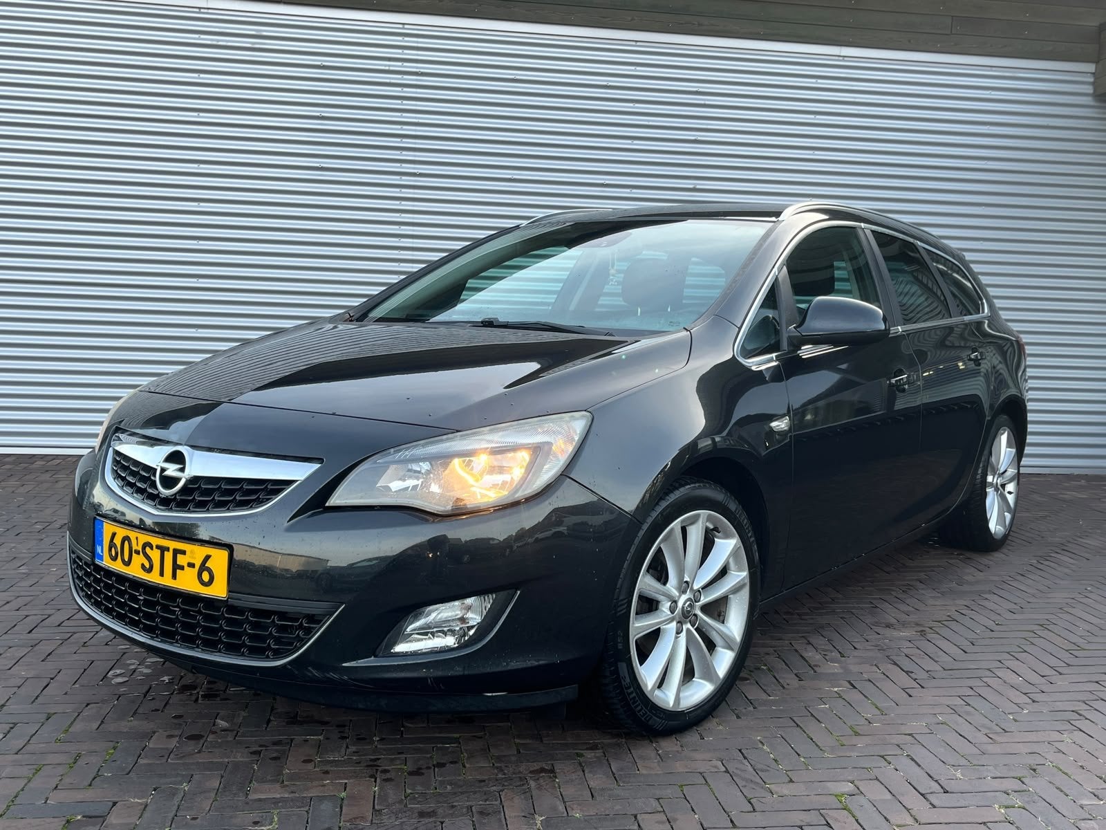 Opel Astra Sports Tourer 1.4 Turbo Selection (bj 2011), Auto's, Voorwielaandrijving, Euro 5, Stof, Gebruikt