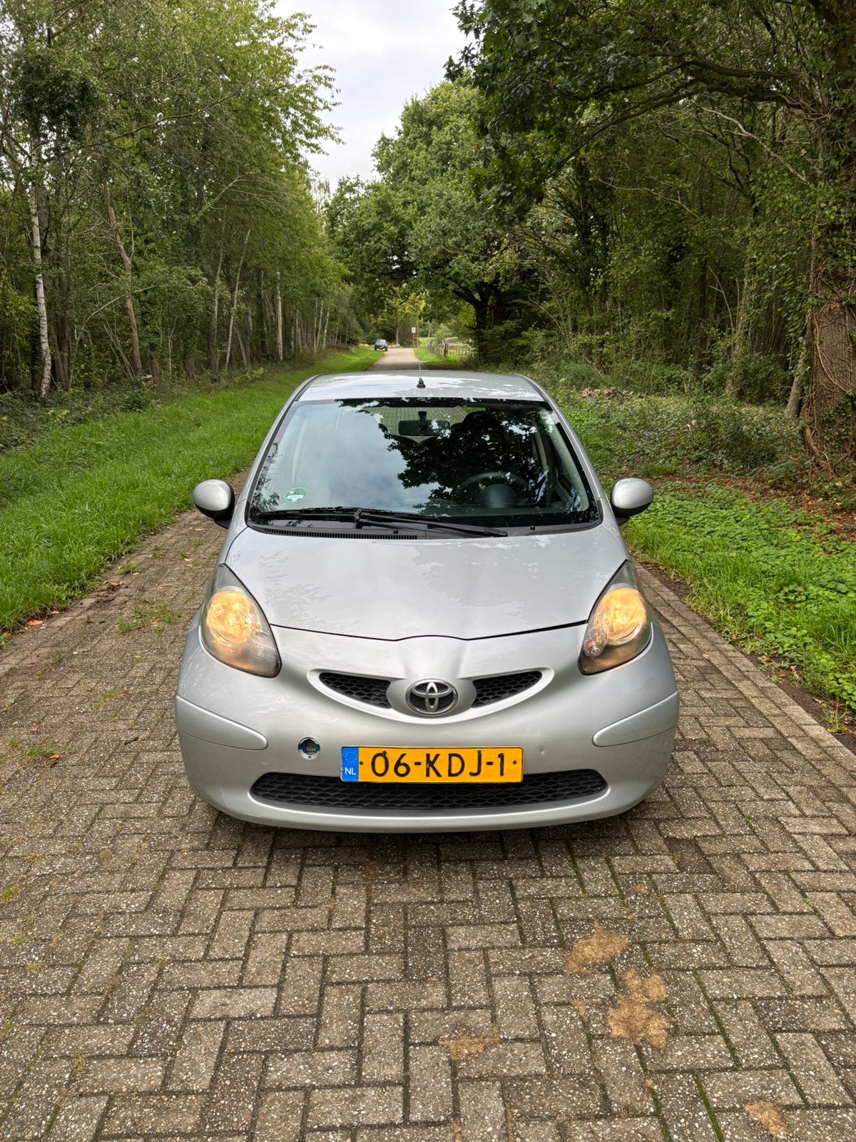Toyota Aygo 1.0 12V Vvt-i 5DRS 2007 Grijs Airco Nieuwe Apk!, Auto's, Voorwielaandrijving, Stof, Zwart, Elektrische ramen
