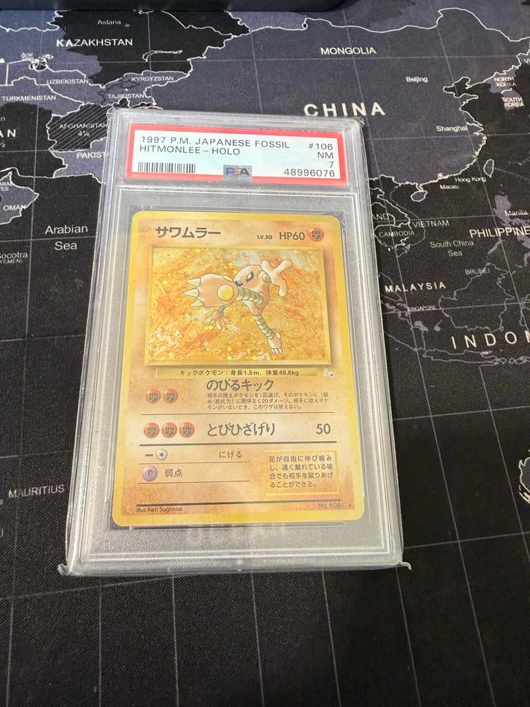 1997 P.M. Japanese Fossil Hitmonlee - Holo PSA 7, Ophalen of Verzenden, Zo goed als nieuw, Losse kaart, Foil