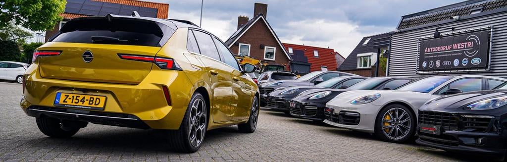 Opel Astra 1.2 Ultimate | Head Up Display | 360 Camera | Sto, Auto's, Opel, Gebruikt, 1199 cc, Automatische klimaatregeling, Geel