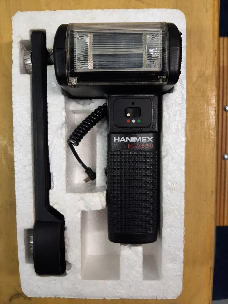 Hanimex Pro 550 Grip Type Thyristor Computer Flashgun, Ophalen of Verzenden, Zo goed als nieuw, Overige merken, Kantelbaar