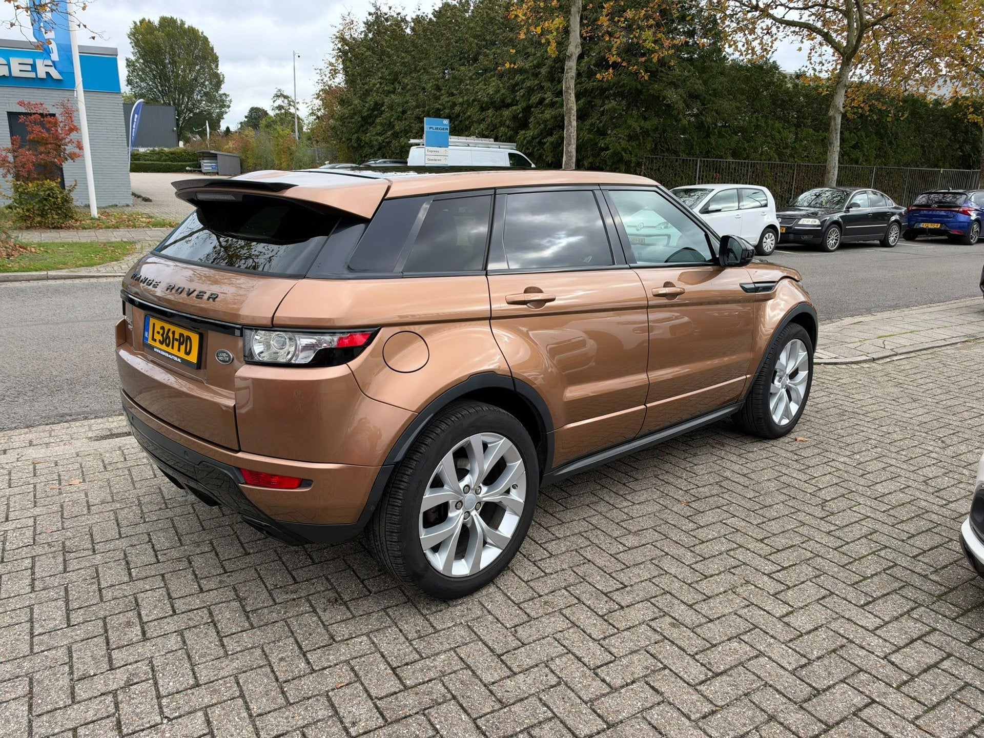 Land Rover Range Rover Evoque 2.0 Si 4WD Prestige Automaat,, Zwart, 4 cilinders, Bruin, Leder