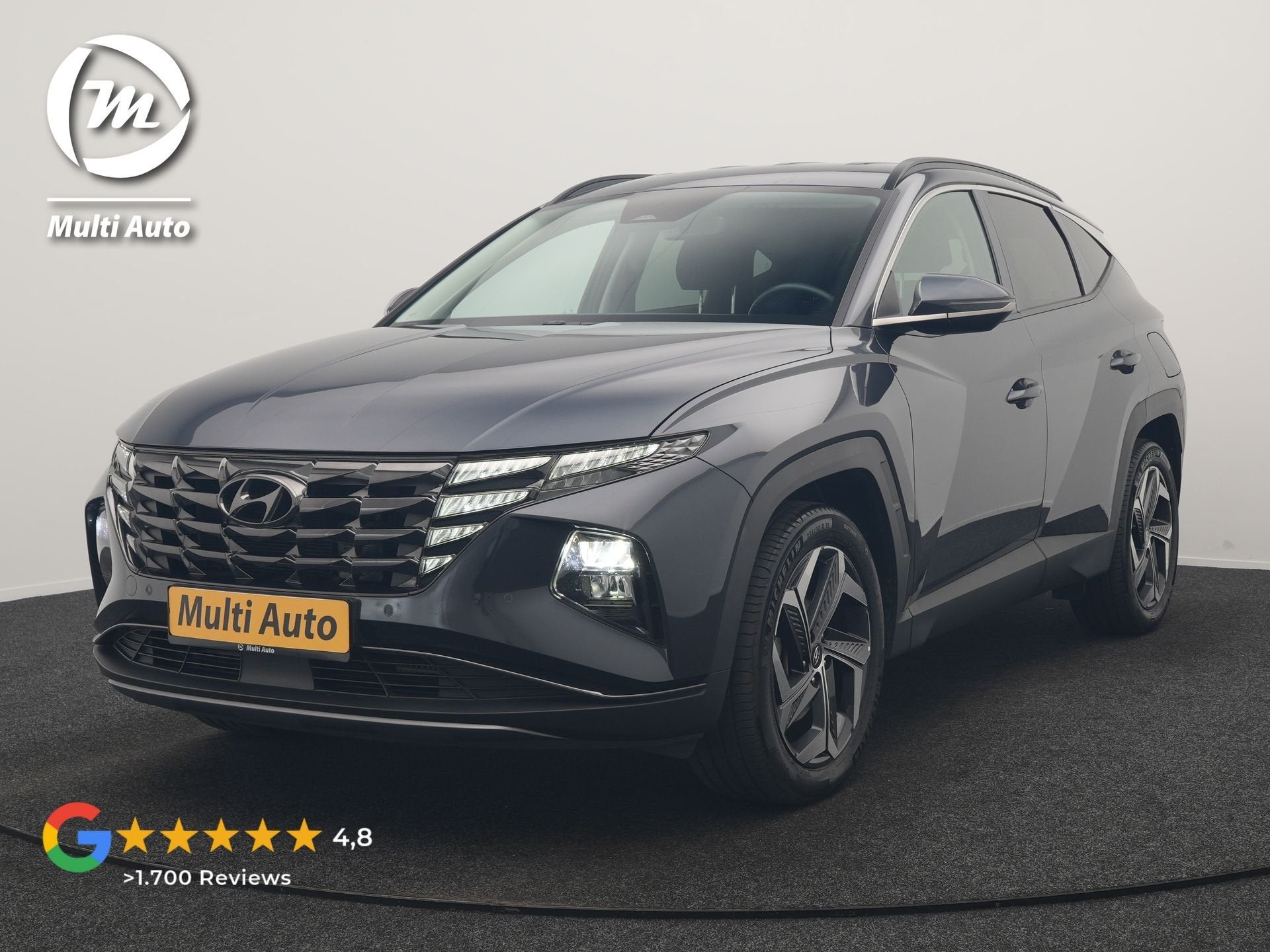 Hyundai Tucson 1.6 T-GDI Comfort 4WD PHEV 265pk Dealer O.H |, Auto's, Automaat, Stof, Gebruikt, Zwart