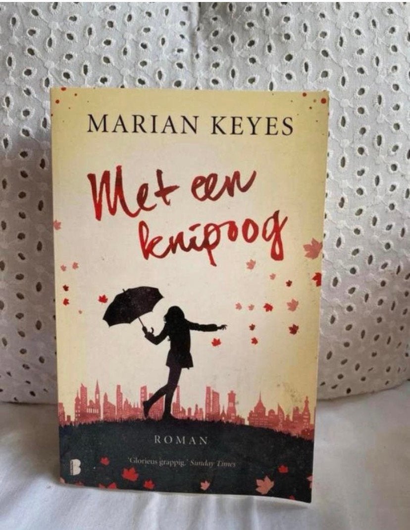 Met een knipoog - Marian Keyes, Ophalen of Verzenden, Zo goed als nieuw